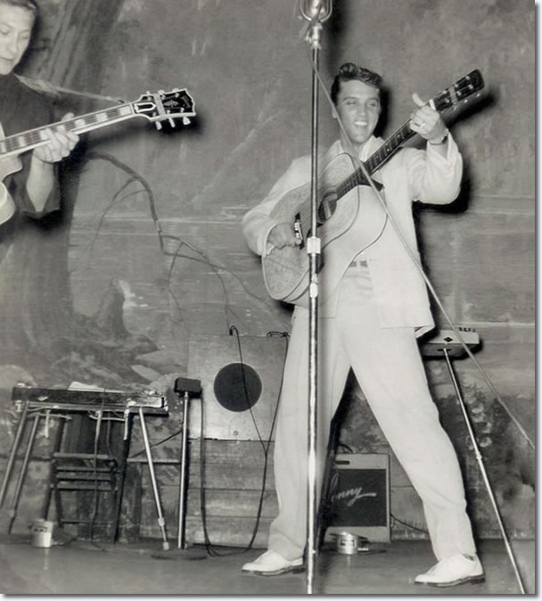 The Hillbilly Cat, as Elvis was nicknamed, performing on stage at the Louisiana Hayride in Shreveport on August 13, 1955. That night, Elvis sang his first record 'That's All Right' and his current first national country hit 'Baby, Let’s Play House'. He also rocked the audience with and a cover of Chuck Berry’s 'Maybellene'. 