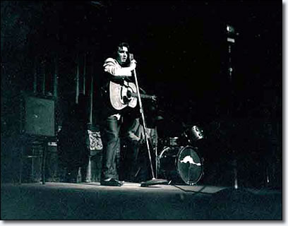 A spotlight captured Elvis on stage at the Minneapolis Auditorium.