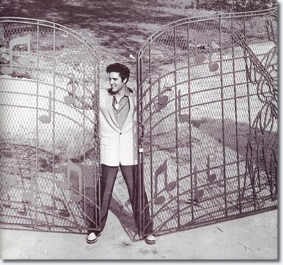 Elvis Presley at the new music gates Graceland in 1957