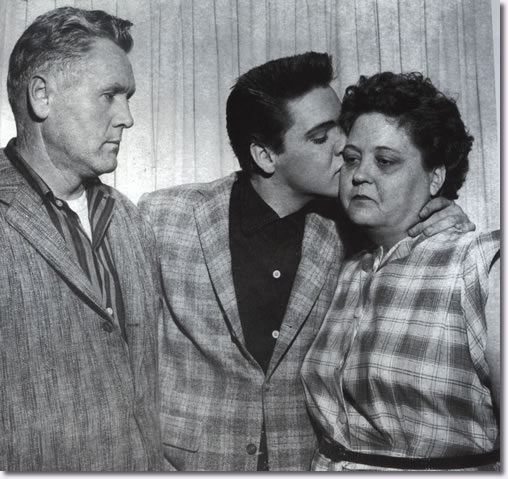 Elvis, kisses his mother goodbye before reporting to the Memphis Draft Board, where he and twelve other recruits are inducted into the US Army. 