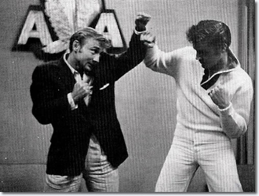 Elvis & Nick Adams are pretending to fight is because Elvis just met with Heavyweight champ Rocky Marciano