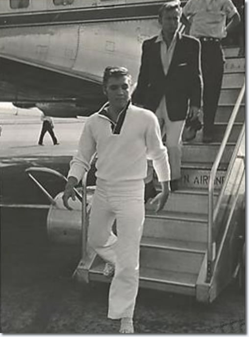 Elvis Presley and Nick Adams disembarking at Memphis Airport.