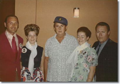 Members of 'The King's Court' fan club from New York with Colonel Parker backstage in Las Vegas on August 31, 1973