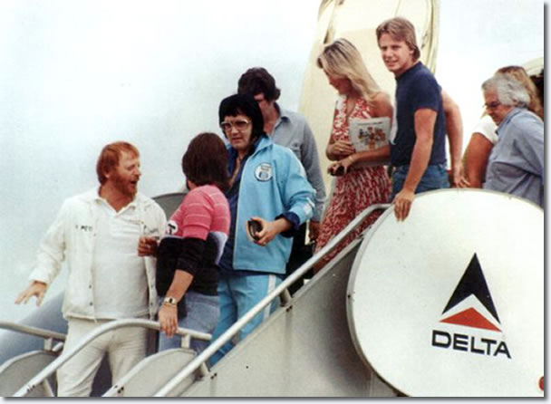 Elvis Presley departing the Lisa Marie with Linda Thompson in Shreveport on July 1, 1976 (also in the photos are Red and Sonny West, Rick Stanley, Lamar Fike and Charlie Hodge)
