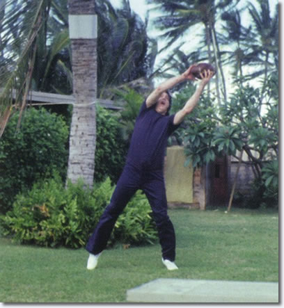 Elvis having fun playing Football in Hawaii March 1977.