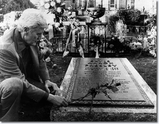 Vernon Presley tends to Elvis' grave